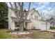 Two-story home with a vinyl siding, attached garage and landscaped yard with mature tree at 6027 Edinmeadow Ln # 29, Charlotte, NC 28269