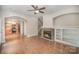 Open-concept living room with hardwood floors, fireplace, and view of the kitchen at 6027 Edinmeadow Ln # 29, Charlotte, NC 28269