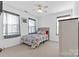 A cozy bedroom featuring a comfortable bed and natural light from the window at 7003 Dacian Ln, Indian Trail, NC 28079