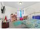 Bright, bedroom, with a playful design and lots of natural light from the window at 7003 Dacian Ln, Indian Trail, NC 28079