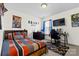 This stylish bedroom features an entertainment center, a large window, and a comfortable bed at 7003 Dacian Ln, Indian Trail, NC 28079