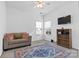 Minimalist bedroom featuring a cozy couch, rug and a TV at 7003 Dacian Ln, Indian Trail, NC 28079