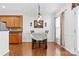 Breakfast nook featuring wood floors, an attractive light fixture, and a view of the backyard at 7003 Dacian Ln, Indian Trail, NC 28079