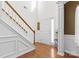 Bright foyer with beautiful hardwood floors, staircase, and detailed trim work at 7003 Dacian Ln, Indian Trail, NC 28079