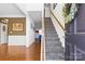 Inviting foyer showcasing a staircase and hardwood floors, with a view into other rooms at 7003 Dacian Ln, Indian Trail, NC 28079