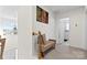 Second floor hallway with a cushioned bench, decor and access to rooms at 7003 Dacian Ln, Indian Trail, NC 28079