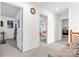 Open hallway features neutral carpet, white walls, and multiple doorways to other rooms at 7003 Dacian Ln, Indian Trail, NC 28079