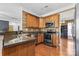 Kitchen showcasing stone countertops, stainless steel appliances, and ample cabinet space at 7003 Dacian Ln, Indian Trail, NC 28079