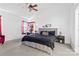 Bright main bedroom featuring a large bed, neutral tones, and lots of light at 7003 Dacian Ln, Indian Trail, NC 28079