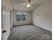 Spacious bedroom featuring a ceiling fan and natural light at 725 Rock Lake Gln, Fort Mill, SC 29715