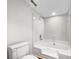 Clean bathroom with a white tiled shower and tub combo, toilet, and modern fixtures at 7340 Winery Ln, Charlotte, NC 28227