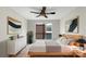 Bedroom featuring a ceiling fan, neutral walls, a large window, and modern decor at 7340 Winery Ln, Charlotte, NC 28227