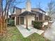 Inviting two-story home featuring a covered porch and a mix of siding and stucco exterior at 7340 Winery Ln, Charlotte, NC 28227