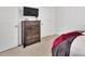 Bedroom featuring a sleek black tv mounted above a rustic dresser at 7623 E Lane Dr, Charlotte, NC 28212