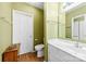 Bathroom with a white vanity, toilet, and linen closet at 766 Marsh Rd # Apt 2, Charlotte, NC 28209