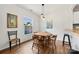 Bright dining area features a round table, pendant lighting, and views of the outdoors at 766 Marsh Rd # Apt 2, Charlotte, NC 28209