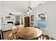 Bright dining area with stylish pendant lighting, a round wooden table and views of the cozy living room at 766 Marsh Rd # Apt 2, Charlotte, NC 28209