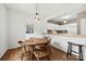 Cozy dining area with round table, pendant lighting, and open concept kitchen view at 766 Marsh Rd # Apt 2, Charlotte, NC 28209