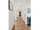 Hallway with hardwood floors leading to the living room at 766 Marsh Rd # Apt 2, Charlotte, NC 28209
