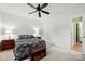 Bright main bedroom with a ceiling fan, and large window providing natural light at 766 Marsh Rd # Apt 2, Charlotte, NC 28209