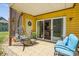 Cozy patio with tile flooring, comfortable seating, and a hanging chair creating a relaxing outdoor space at 766 Marsh Rd # Apt 2, Charlotte, NC 28209