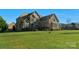 Attractive two-story home featuring brick accents, large windows, and a meticulously maintained lawn at 805 Hidden Pond Ln, Waxhaw, NC 28173