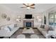 Spacious living room featuring a stone fireplace, recessed lighting, and modern decor at 805 Hidden Pond Ln, Waxhaw, NC 28173