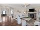 Bright living room with hardwood floors, fireplace, and contemporary furnishings at 805 Hidden Pond Ln, Waxhaw, NC 28173