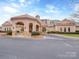 Elegant clubhouse exterior with stone accents, arched entrance, and well-maintained landscaping at 841 Platinum Dr, Fort Mill, SC 29708