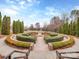 Well-manicured community garden with hedges, benches, and walking paths at 841 Platinum Dr, Fort Mill, SC 29708