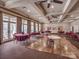 Spacious event room with hardwood dance floor, tables, and ample natural light from large windows at 841 Platinum Dr, Fort Mill, SC 29708