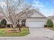 Charming single Gathering home featuring a manicured lawn and an attached two car garage at 841 Platinum Dr, Fort Mill, SC 29708