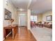 Open concept living room featuring hardwood floors, carpet, and a glass paned front door at 841 Platinum Dr, Fort Mill, SC 29708