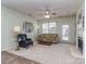 Bright living room with fireplace, neutral carpet, and comfortable seating at 841 Platinum Dr, Fort Mill, SC 29708
