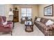 Cozy living room with patterned sofas, a side chair, and a decorative wooden cabinet at 841 Platinum Dr, Fort Mill, SC 29708