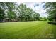 Expansive green space with mature trees, perfect for recreational activities and community gatherings at 875 Stratford Run Dr, Fort Mill, SC 29708