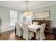 Formal dining room with stylish lighting, elegant decor, and a large window at 875 Stratford Run Dr, Fort Mill, SC 29708