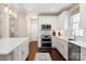 Modern kitchen with white cabinets, granite countertops, and stainless steel appliances at 875 Stratford Run Dr, Fort Mill, SC 29708