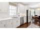 Bright kitchen featuring white cabinets, stainless steel appliances, and a view of the breakfast nook at 875 Stratford Run Dr, Fort Mill, SC 29708