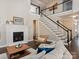 Stylish living room with a fireplace, staircase, and comfortable seating at 875 Stratford Run Dr, Fort Mill, SC 29708