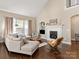 Cozy living room with a fireplace, vaulted ceilings, and plenty of natural light at 875 Stratford Run Dr, Fort Mill, SC 29708