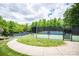 Community tennis courts featuring well-maintained playing surfaces and a secure perimeter fence at 875 Stratford Run Dr, Fort Mill, SC 29708
