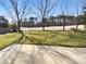 Backyard lawn and trees provide ample space for recreation at 9139 Hearst Ct, Charlotte, NC 28269