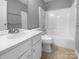 Clean bathroom featuring white fixtures, a shower-tub combo, and neutral tones at 9139 Hearst Ct, Charlotte, NC 28269