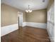 Traditional dining room featuring hardwood floors, chair rail molding, and ample natural light at 9139 Hearst Ct, Charlotte, NC 28269