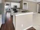Well-lit kitchen featuring white cabinets, stainless steel appliances, and an island at 9139 Hearst Ct, Charlotte, NC 28269