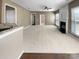 Spacious living room features neutral paint, fireplace, carpet, ceiling fan, and bright, windowed natural light at 9139 Hearst Ct, Charlotte, NC 28269