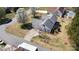 Aerial view of home featuring a long driveway and tree coverage around the property at 919 42Nd Avenue Ne Ln, Hickory, NC 28601
