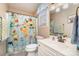 Bright bathroom featuring a tiled shower with fun animal themed shower curtain at 919 42Nd Avenue Ne Ln, Hickory, NC 28601