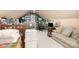 Attic space with slanted ceiling, couch, bed and desk used as a bedroom at 919 42Nd Avenue Ne Ln, Hickory, NC 28601